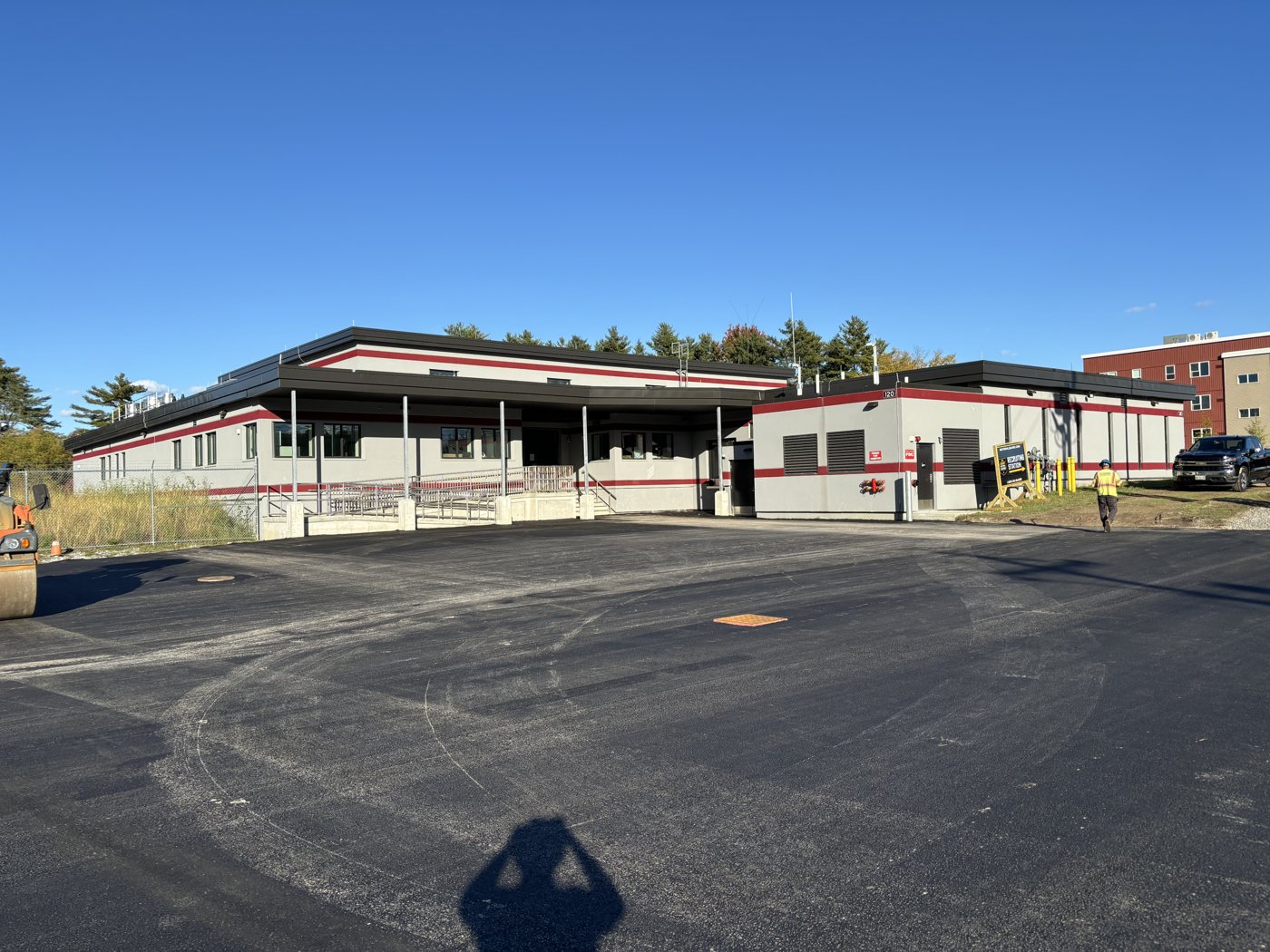 The finished Westbrook Armory parking lot, fresh pavement in front of the armory building